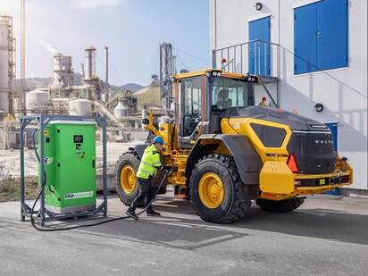 Operator charging up a large electric Volvo L90 wheel loader.